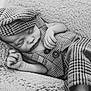 Adam participe au concours pour gagner de l'argent avec cette photo : baby, infant, sleeping, plaid, hat, cap, clothing, blanket, soft, texture, black_and_white, portrait, cute, newborn, peaceful, resting, child, cozy, hands, closed_eyes