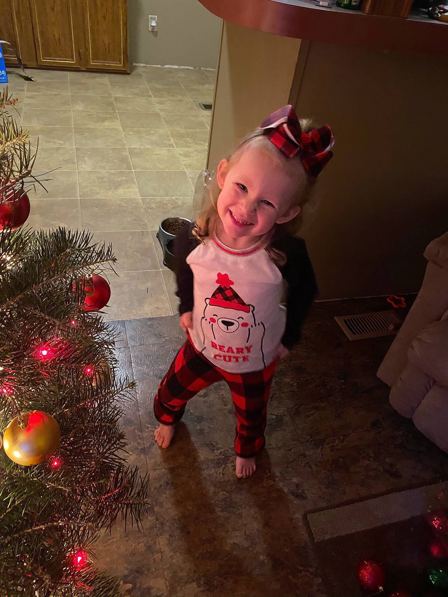 Jaycee is registered to the contest to win money with this photo: child, christmas, christmas_decoration, christmas_eve, christmas_ornament, christmas_tree, costume, fir, holiday, holiday_ornament, interior_design, joy, person, smile, standing, toddler, tree