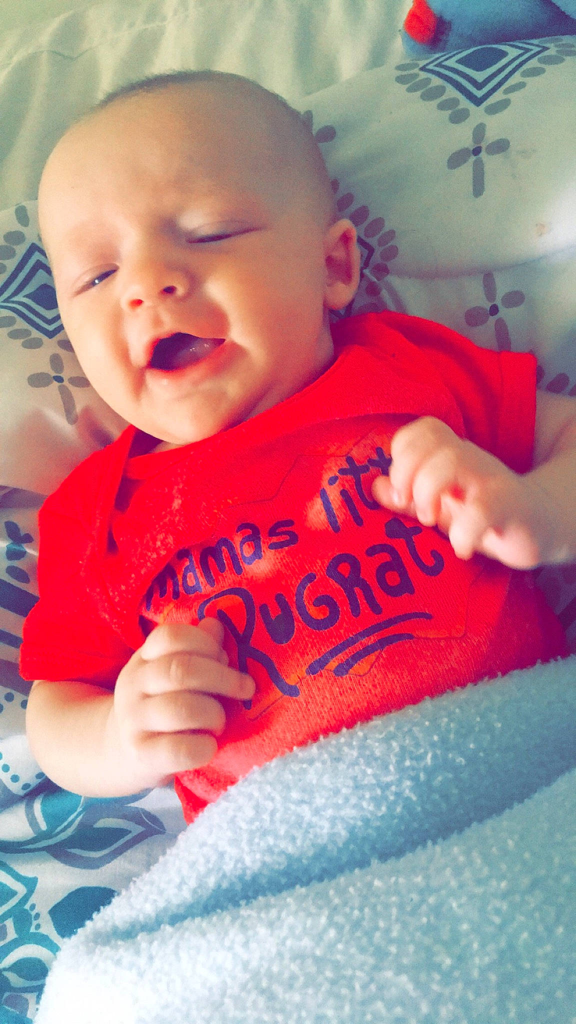 Bryson is registered to the contest to win money with this photo: arm, baby, baby_toddler_clothing, cheek, facial_expression, finger, hand, happy, human, iris, lip, mammal, mouth, nose, orange, person, pink, skin, sleeve, smile