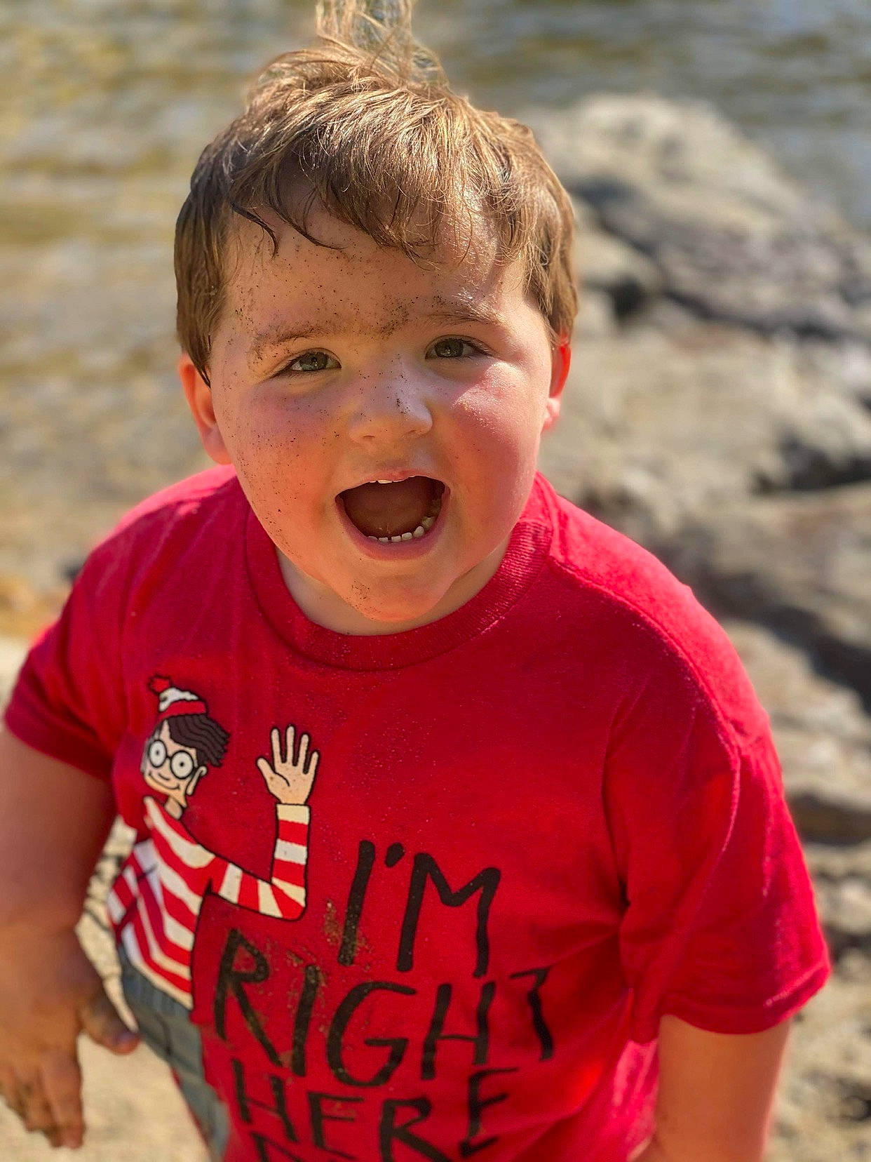 Blayne is registered to the contest to win money with this photo: chin, eye, facial_expression, forehead, fun, hair, happy, head, leisure, mouth, neck, nose, people_in_nature, person, skin, sleeve, standing, t_shirt, toddler, travel