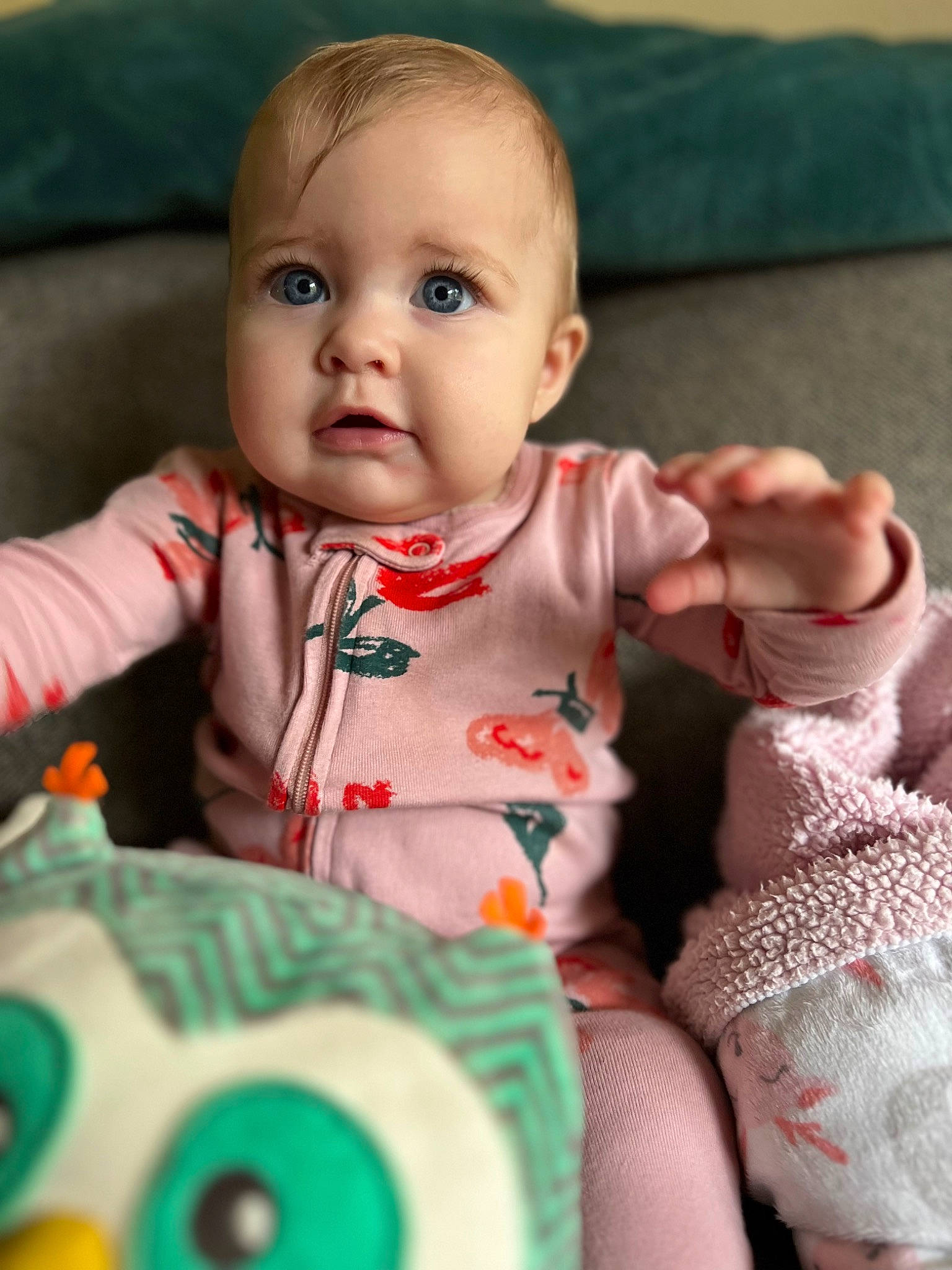 Magnolia is registered to the contest to win money with this photo: arm, baby, baby_toddler_clothing, cheek, chin, eye, facial_expression, finger, green, happy, head, human_body, iris, lip, mouth, nose, person, product, skin, sleeve