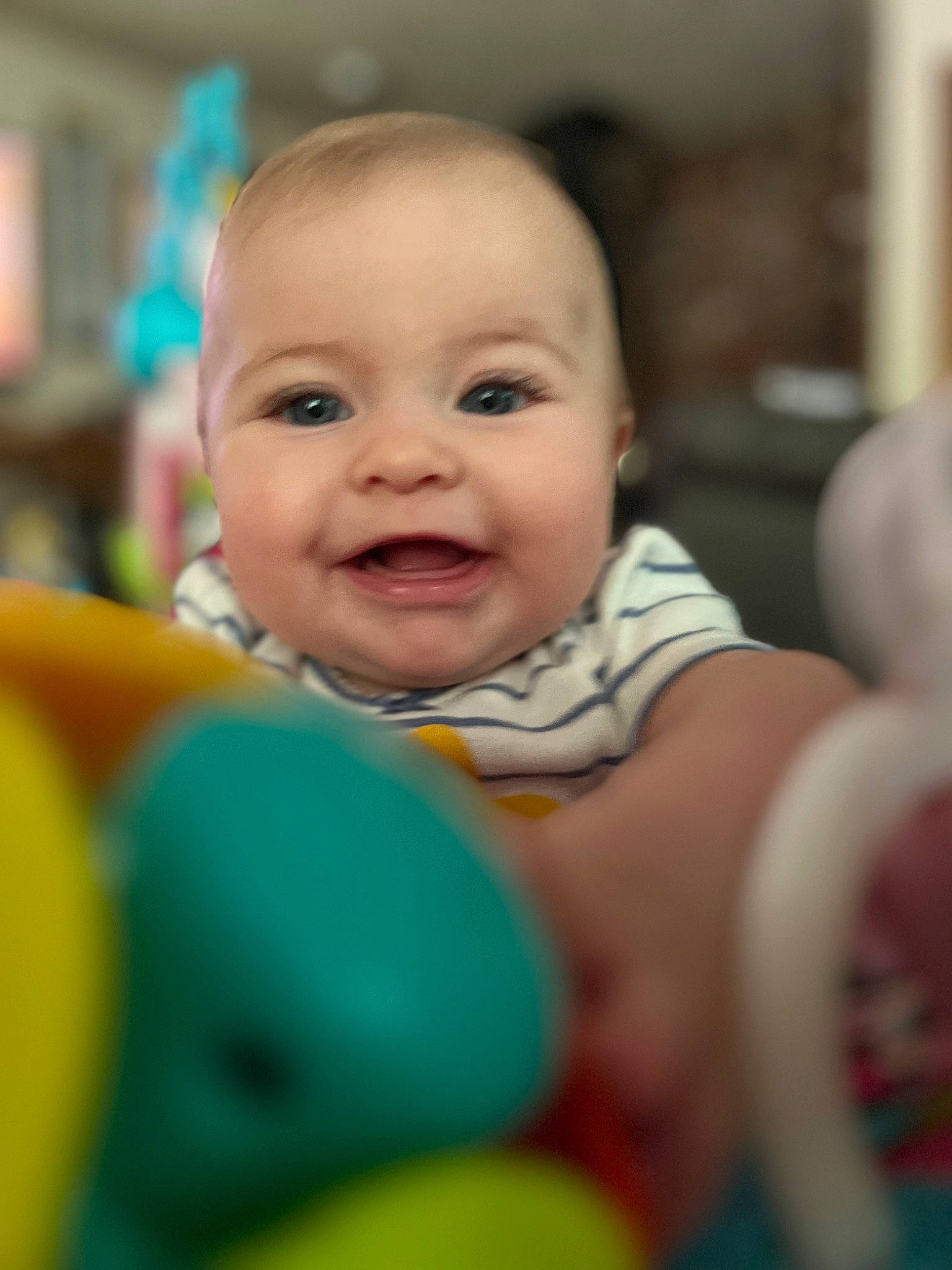 Magnolia is registered to the contest to win money with this photo: baby, baby_laughing, baby_playing_with_toys, baby_products, baby_toddler_clothing, cheek, child, event, facial_expression, fun, happy, human, iris, joy, laugh, leisure, person, play, room, skin