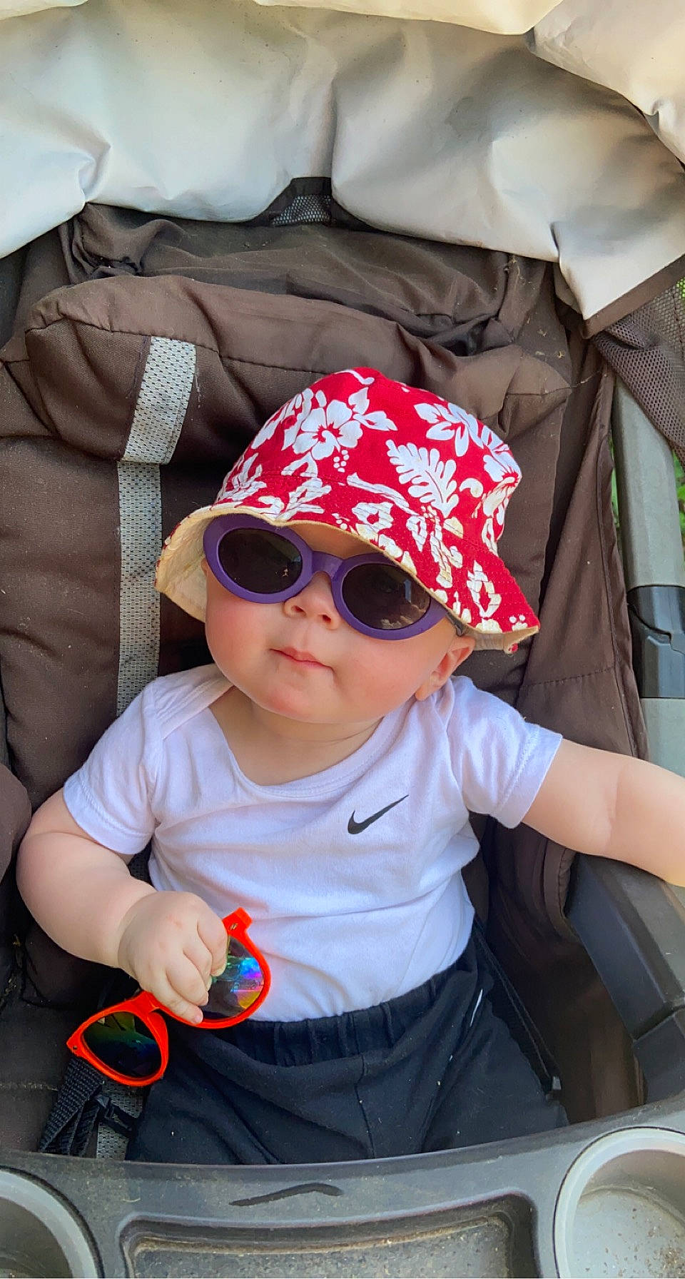 Braxton joined the competition — help win amazing prizes! baby, baby_toddler_clothing, baseball_cap, cap, cool, eyewear, glasses, goggles, hat, headgear, headwear, lip, mouth, person, pink, skin, sleeve, smile, sun_hat, sunglasses