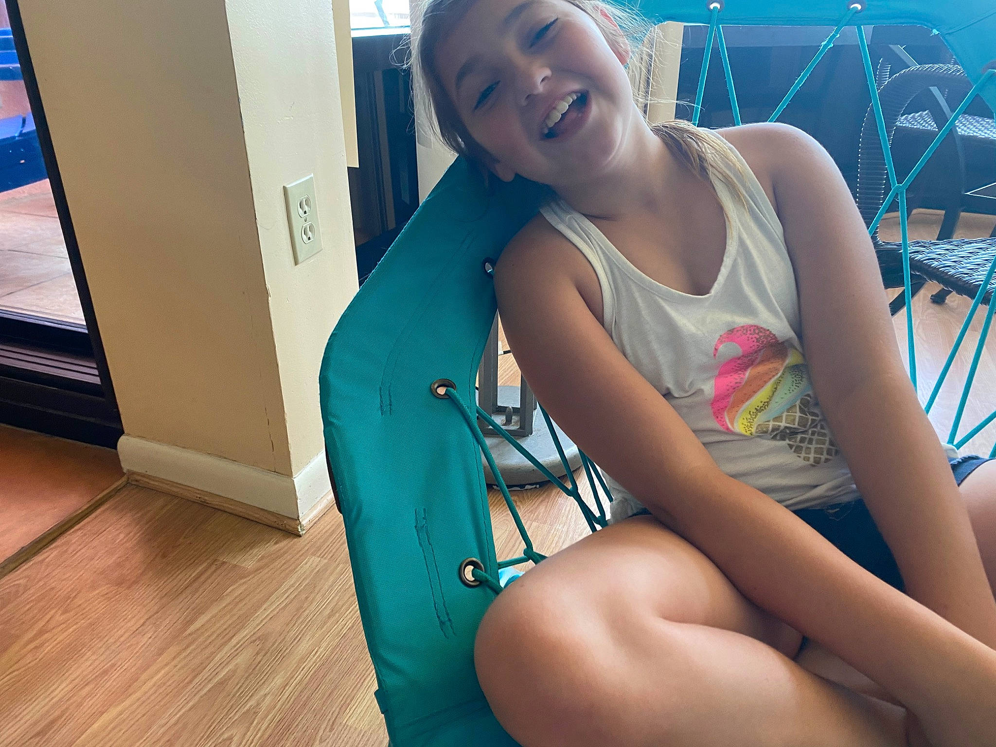 Tegan joined the competition — help win amazing prizes! black_hair, brown_hair, chest, elbow, electric_blue, foot, fun, happy, human_leg, joint, joy, knee, leg, leisure, long_hair, person, shoulder, sitting, smile, sportswear