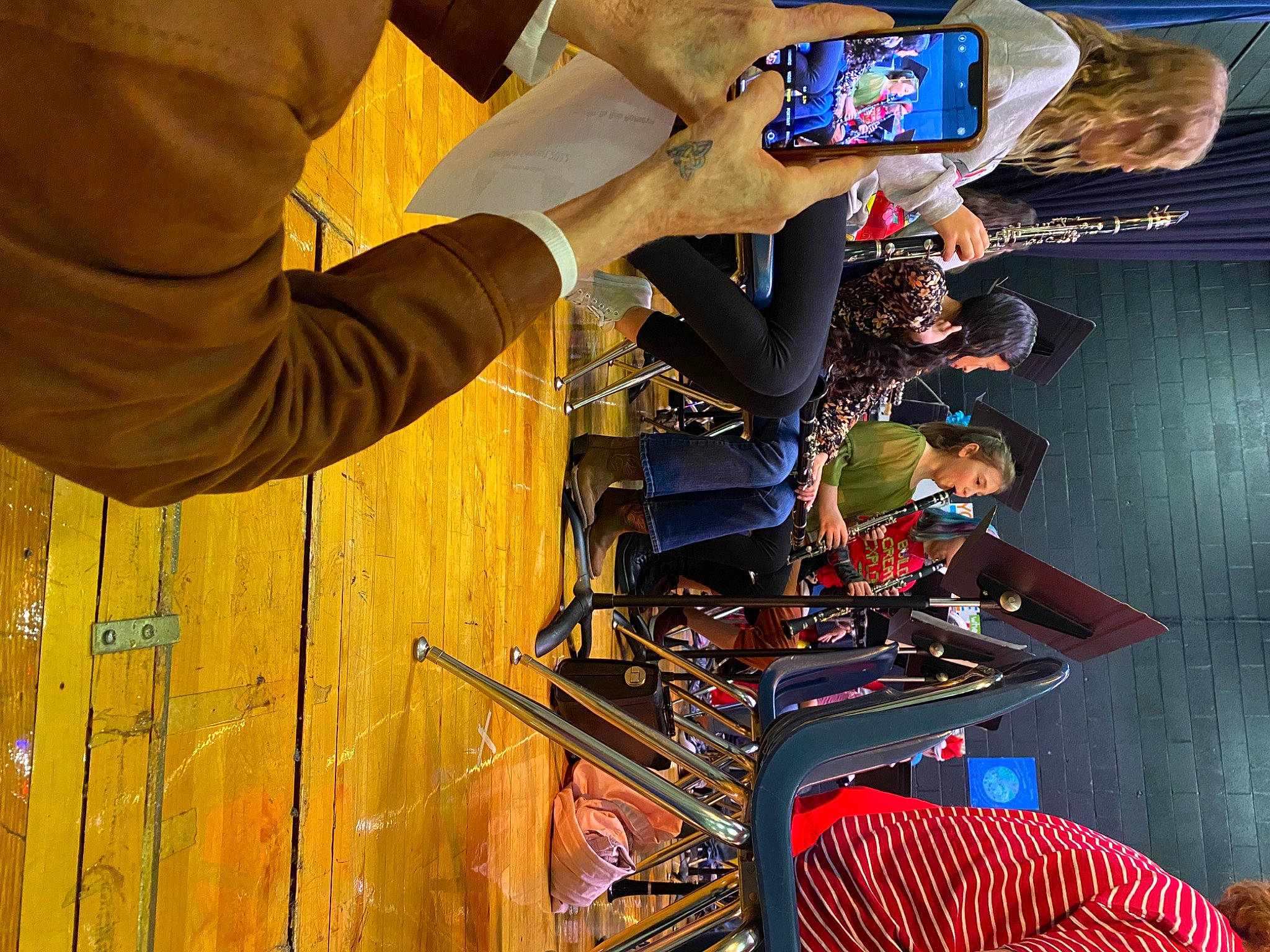 Tegan joined the competition — help win amazing prizes! audio_equipment, engineering, fun, games, gesture, machine, person, personal_protective_equipment, recreation, room, wood, wrist