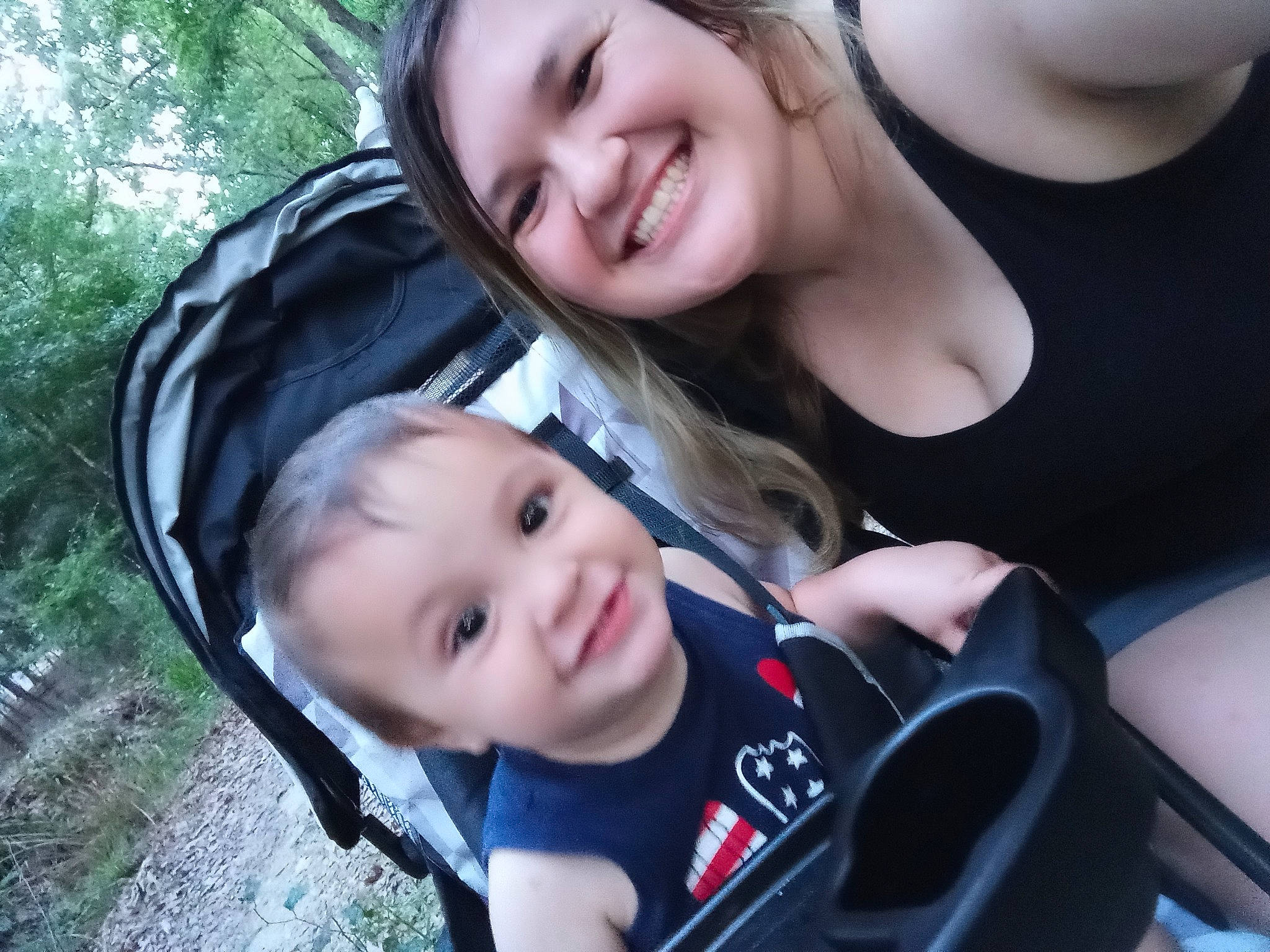 Shaden is registered to the contest to win money with this photo: auto_part, baby, baby_carriage, baby_products, car_seat, child, fun, gesture, grass, happy, joy, laugh, leisure, people_in_nature, person, plant, recreation, sitting, smile, toddler