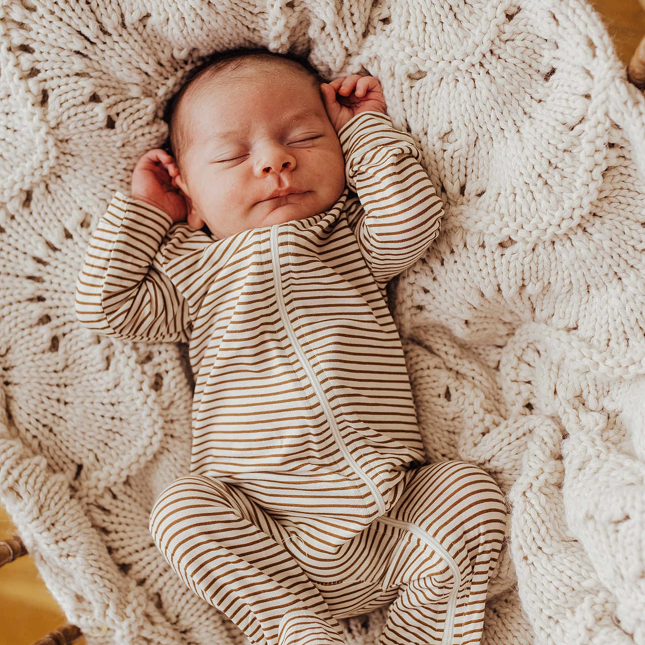 Enzo joined the competition — help win amazing prizes! baby, newborn, sleeping, striped_clothing, blanket, knitted, cradle, wood, infant, cozy, cute, peaceful, resting, portrait, child, soft, warm, indoors, person, one_piece