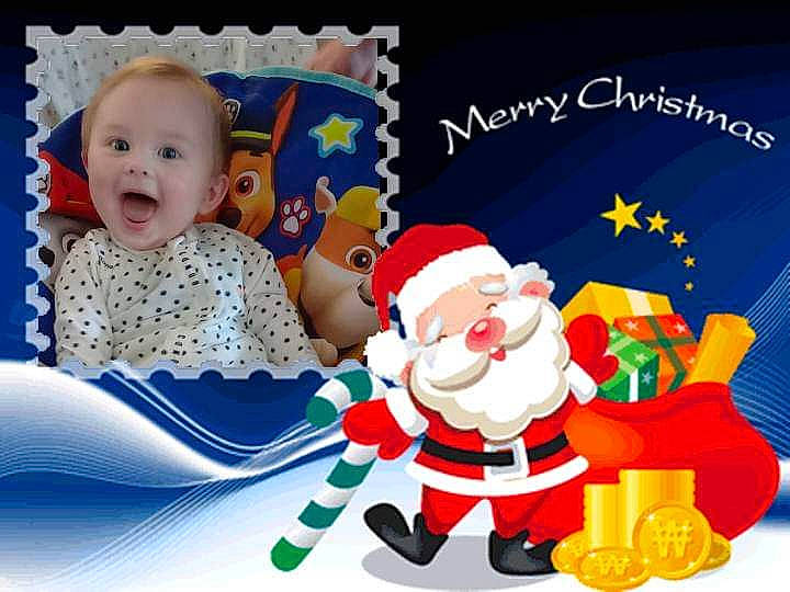 Jayde is registered to the contest to win money with this photo: animated_cartoon, art, baby, baby_toddler_clothing, child, event, fictional_character, font, fun, graphics, greeting, happy, holiday, illustration, pattern, person, product, rectangle, santa_claus, smile