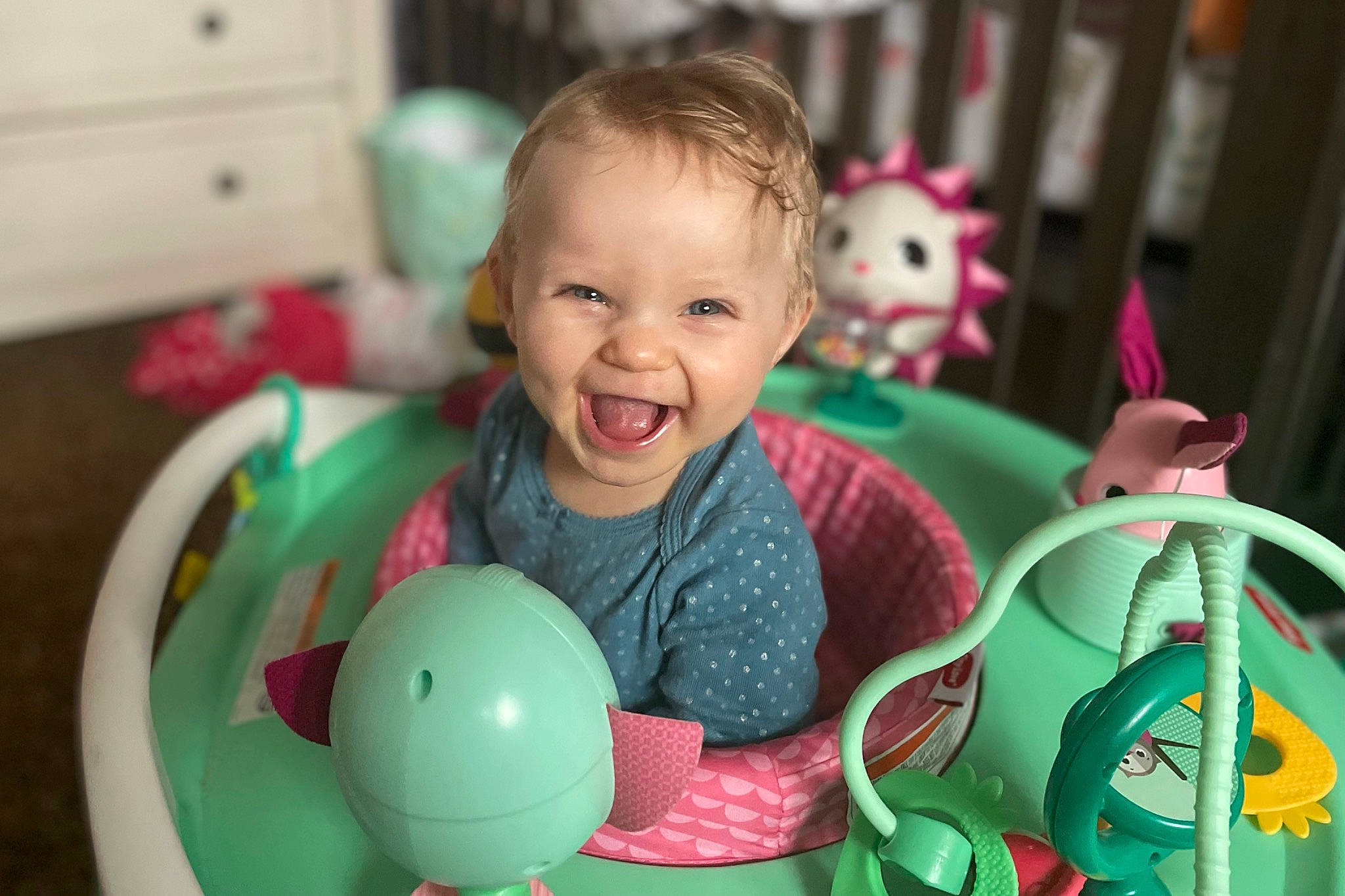 Kamryn joined the competition — help win amazing prizes! baby, baby_playing_with_toys, baby_toddler_clothing, baby_toys, cabinetry, child, event, fun, green, happy, holiday, leisure, organ, person, riding_toy, room, sitting, smile, snapshot, toddler