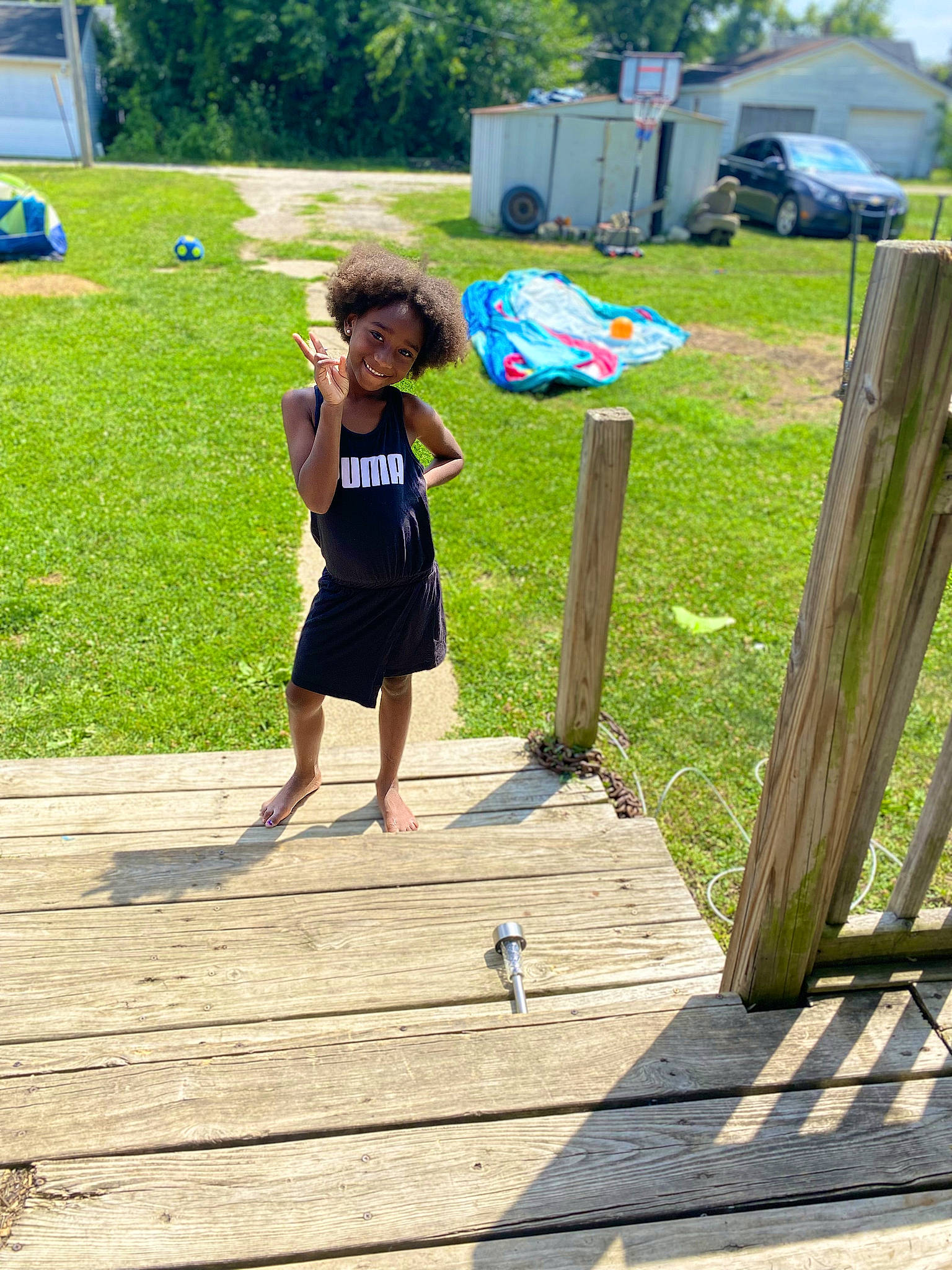 A'Aleigha joined the competition — help win amazing prizes! barefoot, boardwalk, car, child, competition_event, electric_blue, fun, grass, joy, leisure, people_in_nature, person, plant, recreation, sidewalk, summer, t_shirt, tire, toddler, tree