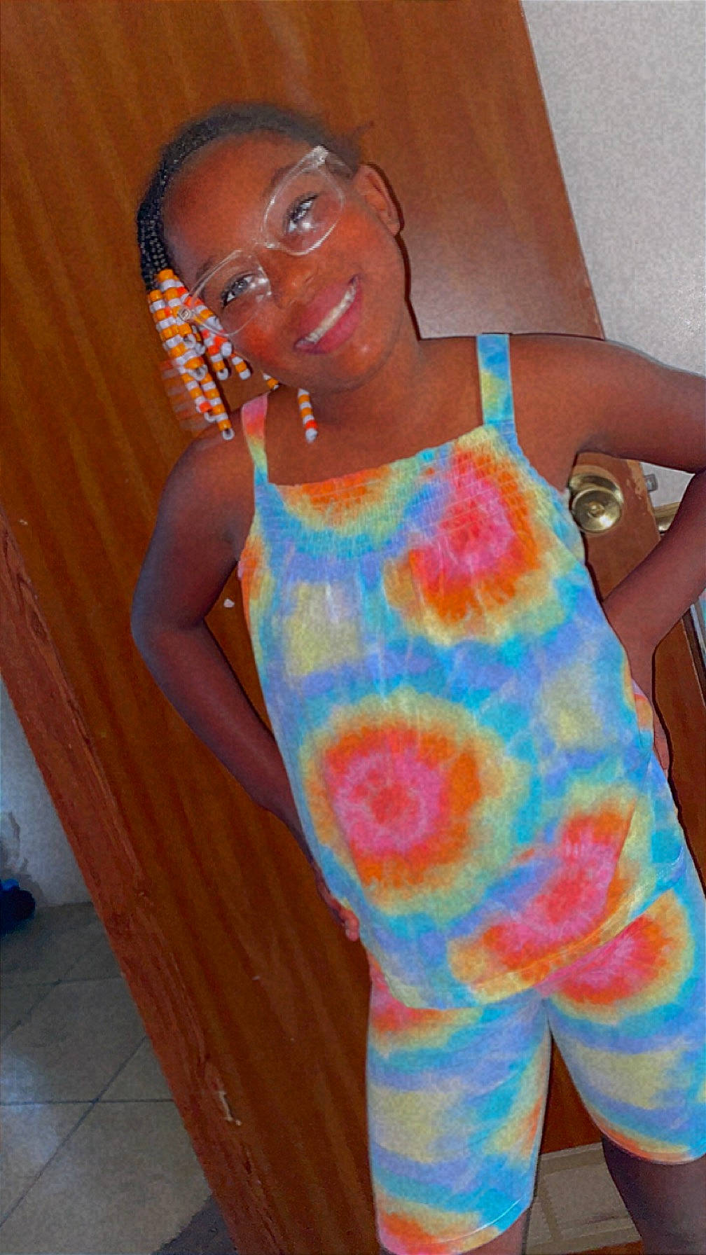 A'Nyiah joined the competition — help win amazing prizes! arm, baby_toddler_clothing, child, dress, finger, glasses, hand, happy, joint, joy, neck, orange, pattern, person, shoulder, skin, sleeve, smile, t_shirt, textile