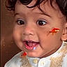 toddler, child, face, curly_hair, big_eyes, smile, white_clothing, embroidered_outfit, goldfish, fish, cute, portrait, indoor, happy, closeup, baby, person, expression, funny, colorful