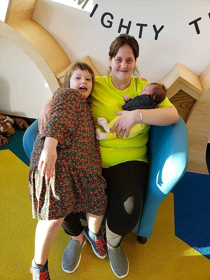 Theresa is registered to the contest to win money with this photo: comfort, flooring, friendship, fun, gesture, hairstyle, happy, interaction, joint, joy, knee, leisure, person, shoe, shoulder, smile, sneakers, standing, style, t_shirt