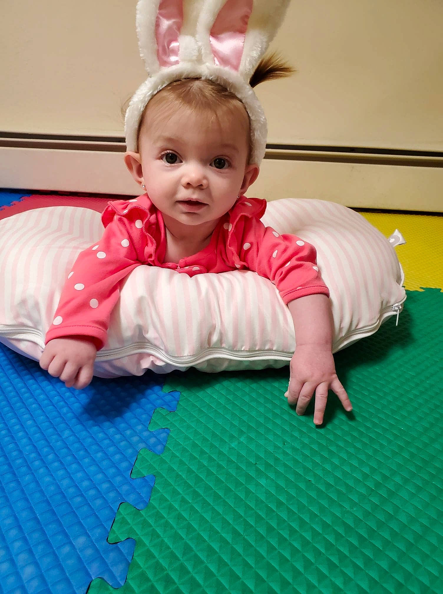 Lorelai joined the competition — help win amazing prizes! arm, baby, child, crawling, ear, floor, flooring, fun, green, happy, head, leisure, person, pink, play, room, sitting, skin, smile, toddler