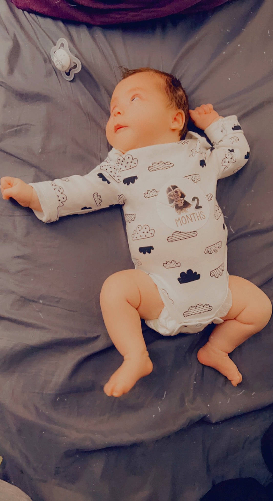 Lilith is registered to the contest to win money with this photo: baby, baby_toddler_clothing, barefoot, cheek, child, comfort, eye, face, finger, foot, happy, head, human_body, human_leg, leg, person, sitting, skin, sleeve, t_shirt