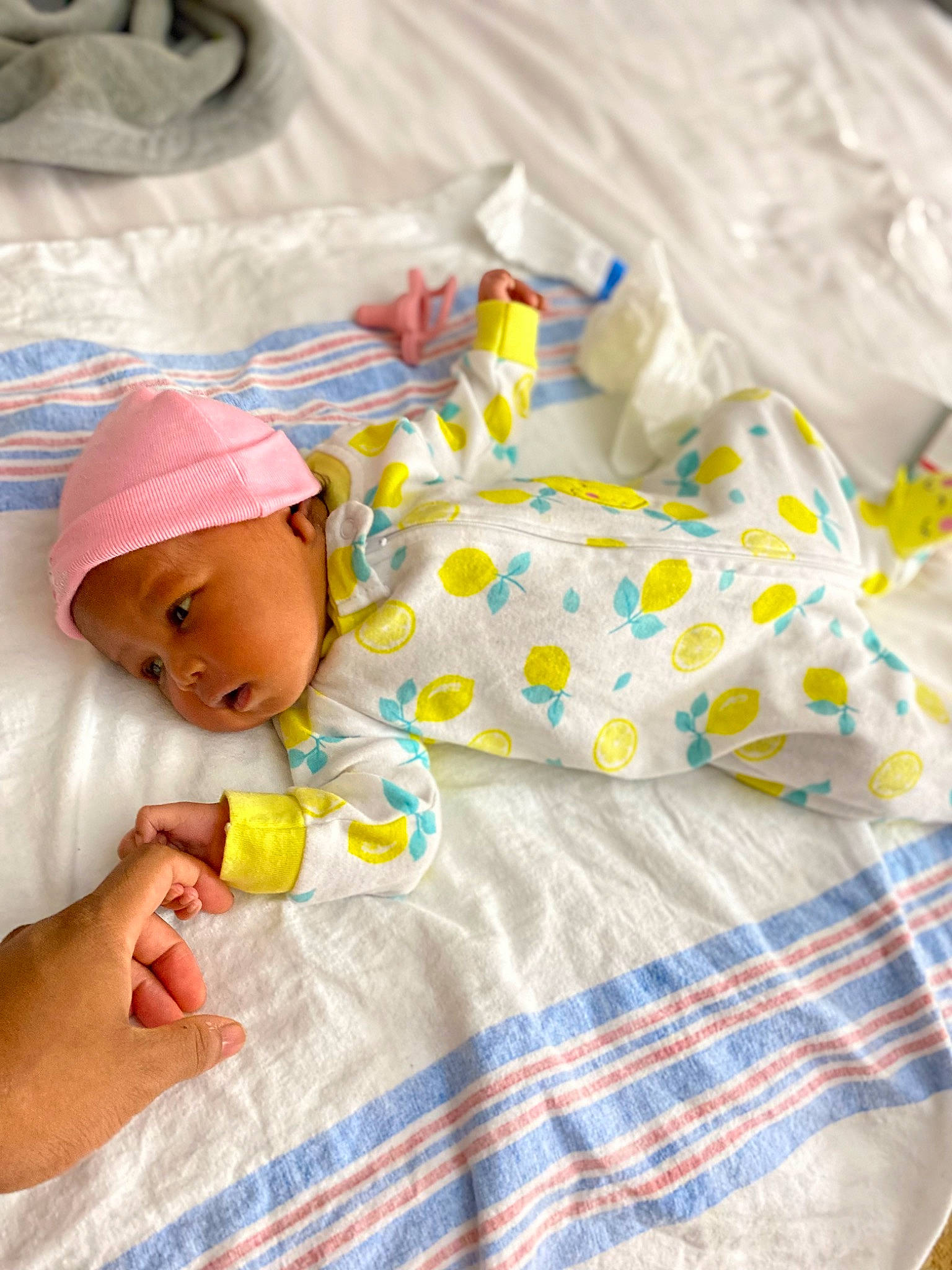 Madison joined the competition — help win amazing prizes! baby, baby_products, baby_sleeping, baby_toddler_clothing, bedding, bedtime, child, comfort, dress, hand, hat, head, headwear, human_body, linens, pattern, person, room, skin, textile