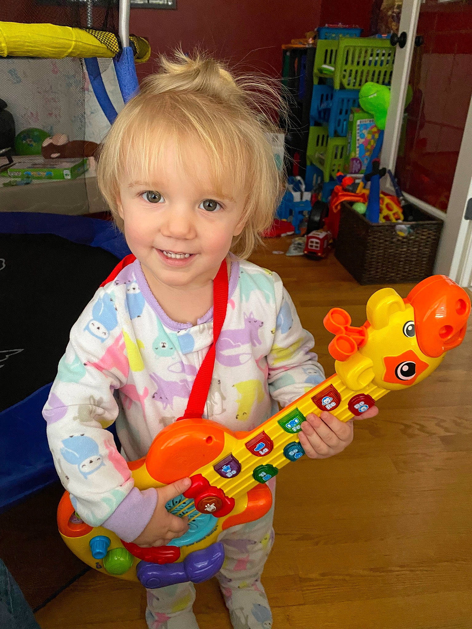 Aniston is registered to the contest to win money with this photo: baby_playing_with_toys, baby_toys, child, joy, musical_instrument, person, play, toddler, toy