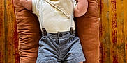 Elias joined the competition — help win amazing prizes! baby, child, clothing, cushion, cute, face, fashion, hat, indoor, infant, mittens, person, plush, portrait, relaxing, shorts, smile, socks, wooden_floor, young