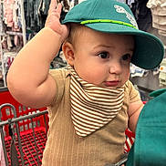 Elias joined the competition — help win amazing prizes! arm, baby, cap, cheeks, child, clothing, curious, cute, face, hat, indoor, infant, portrait, retail, seat, shopping, shopping_cart, store, striped_bib, young_child