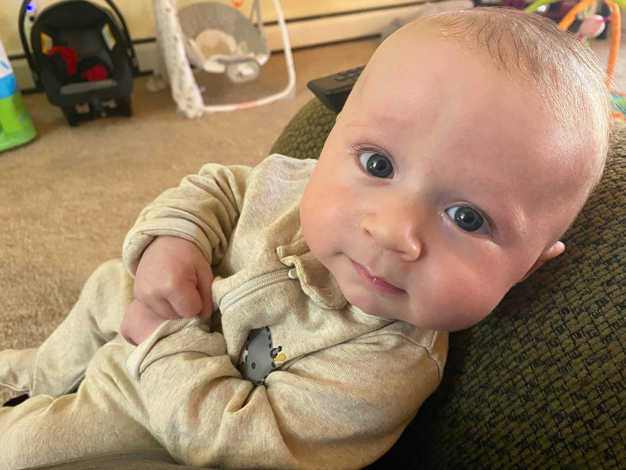 Casey joined the competition — help win amazing prizes! baby, baby_toddler_clothing, cheek, child, chin, comfort, ear, eye, eyelash, flooring, grass, happy, iris, luggage_and_bags, nose, person, skin, smile, toddler, tummy_time