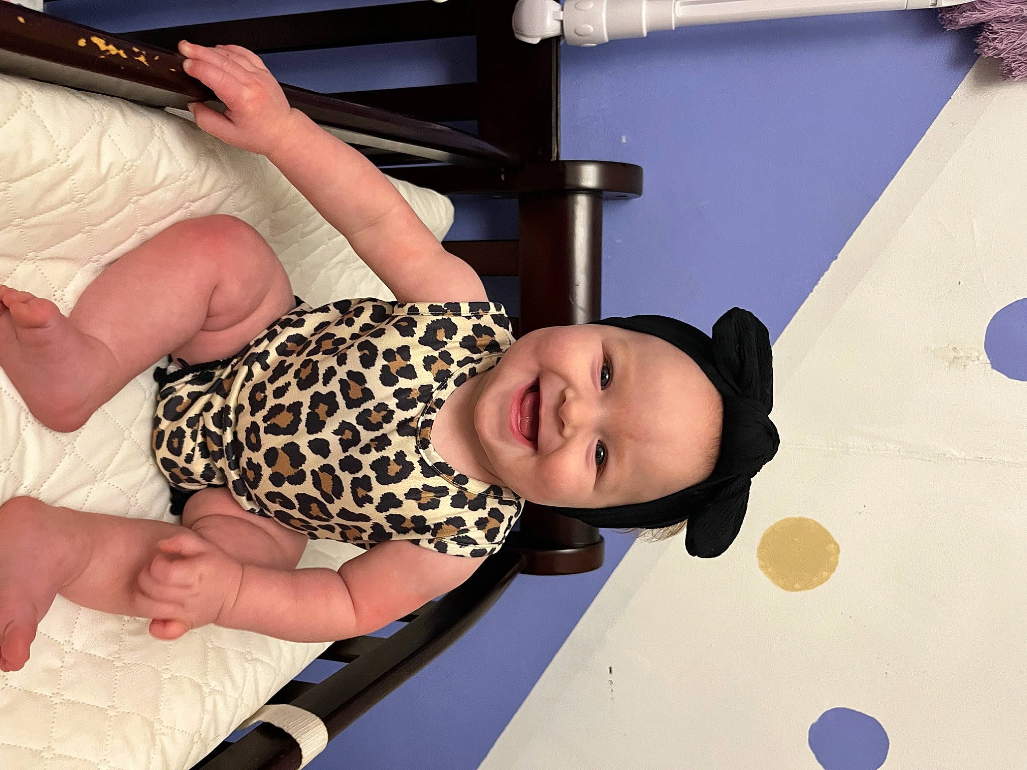 Emerie is registered to the contest to win money with this photo: baby_toddler_clothing, chest, child, comfort, elbow, foot, fun, gesture, hand, happy, headwear, human_leg, joy, knee, leisure, nail, person, room, smile, thigh
