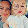 Léna a rejoint le concours — aidez-le/la à gagner de superbes lots ! adult, toddler, glasses, digital_filter, emoji, strawberry, car_interior, smile, face, person, child, cute, happy, holding, clothing, short_hair, casual, portrait, closeup, fun