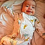 Sire joined the competition — help win amazing prizes! baby, infant, smiling, onesie, bed, blanket, sleepwear, animal_print, cute, child, face, young, lying_down, comfort, warm_light, cozy, person, happy, tongue_out, indoor