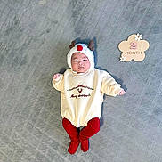 Serena is registered to the contest to win money with this photo: 2_month, adorable, baby, child, christmas, cozy, cream_sweater, cute, festive, gray_blanket, holiday, indoors, infant, lying_down, portrait, red_pants, reindeer_hat, seasonal, smiling, wooden_sign