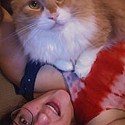 Curtis Jackson joined the competition — help win amazing prizes! animal, candid, casual, cat, close_up, companion, cute, face, glasses, happy, human, indoor, orange_cat, person, pet, resting, smiling, tie_dye, white_fur, young_adult