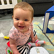 Chloe joined the competition — help win amazing prizes! architecture, baby, bodypart, building, couch, crawling, crib, face, finger, furniture, hand, happy, head, indoors, livingroom, person, photography, portrait, room, sitting