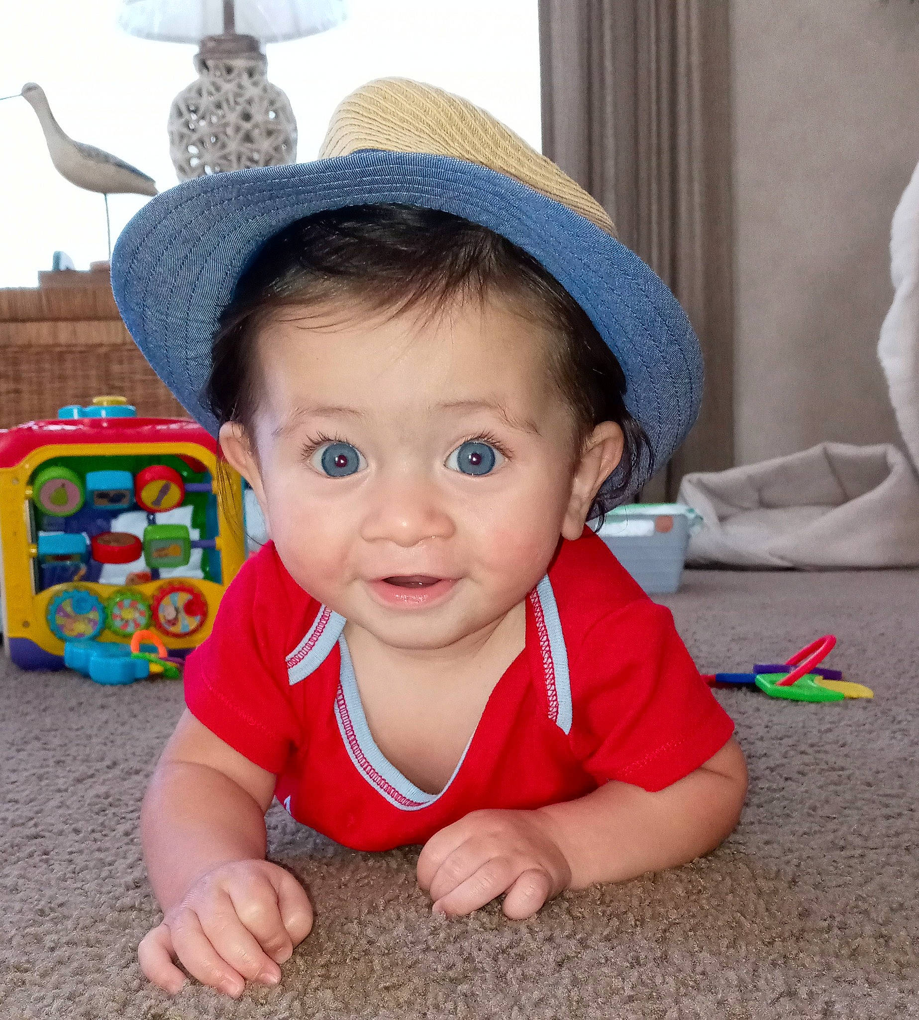 Johnny is registered to the contest to win money with this photo: baby, baby_toddler_clothing, cap, cheek, child, chin, eye, face, facial_expression, fun, hairstyle, happy, hat, head, headgear, leisure, person, skin, smile, sun_hat
