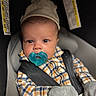Kamari joined the competition — help win amazing prizes! baby, pacifier, car_seat, plaid_shirt, mittens, hat, striped_hat, infant, child, seatbelt, closeup, indoor, warning_label, cute, portrait, young_child, apparel, safety, expression, wearing