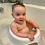 Skye joined the competition — help win amazing prizes! baby, bathtub, bath_seat, bubbles, child, curly_hair, face, happy, indoors, person, plant, pink, portrait, sitting, smile, water, wet, white, young_child, bathroom