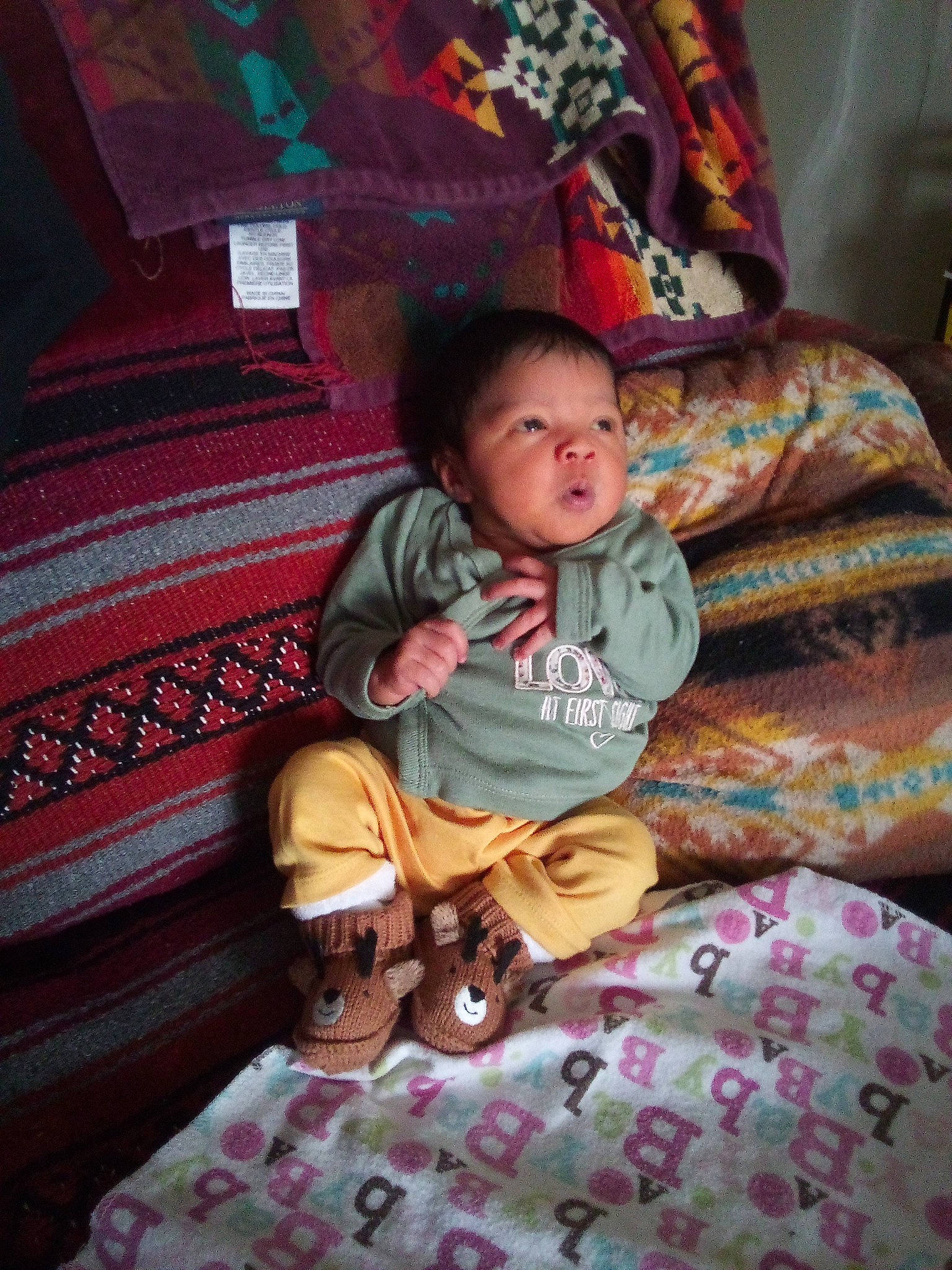 Callie joined the competition — help win amazing prizes! baby, baby_toddler_clothing, bedding, bedtime, child, comfort, flooring, fun, head, lap, linens, magenta, pattern, person, pink, purple, room, sitting, textile, toddler