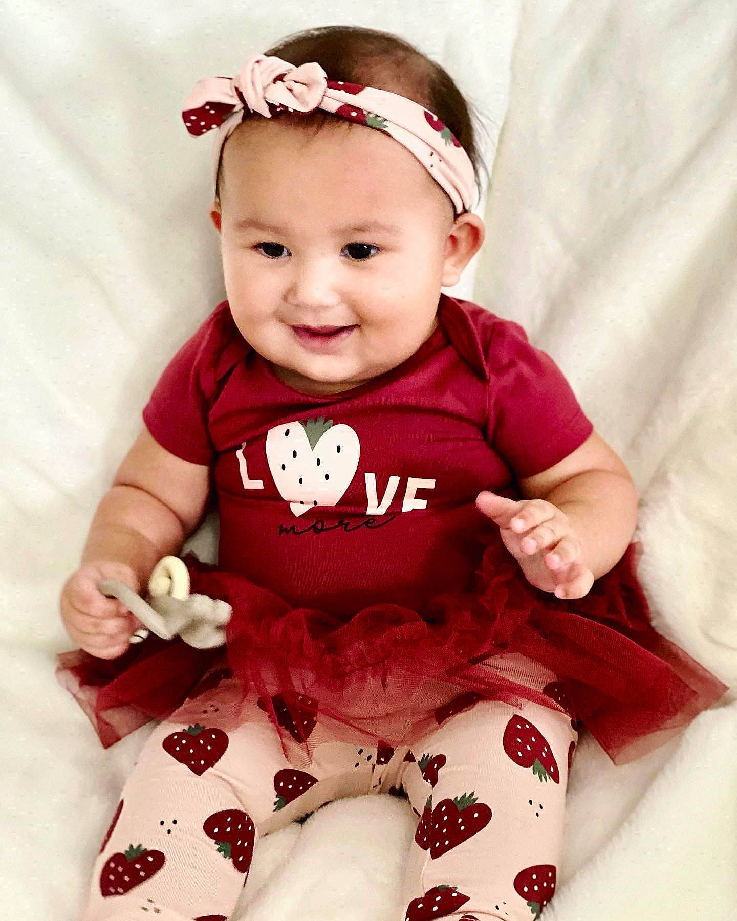 Elora joined the competition — help win amazing prizes! baby, baby_toddler_clothing, cap, cheek, collar, dress, face, glasses, happy, head, headwear, joy, lip, magenta, neck, pattern, person, pink, skin, sleeve