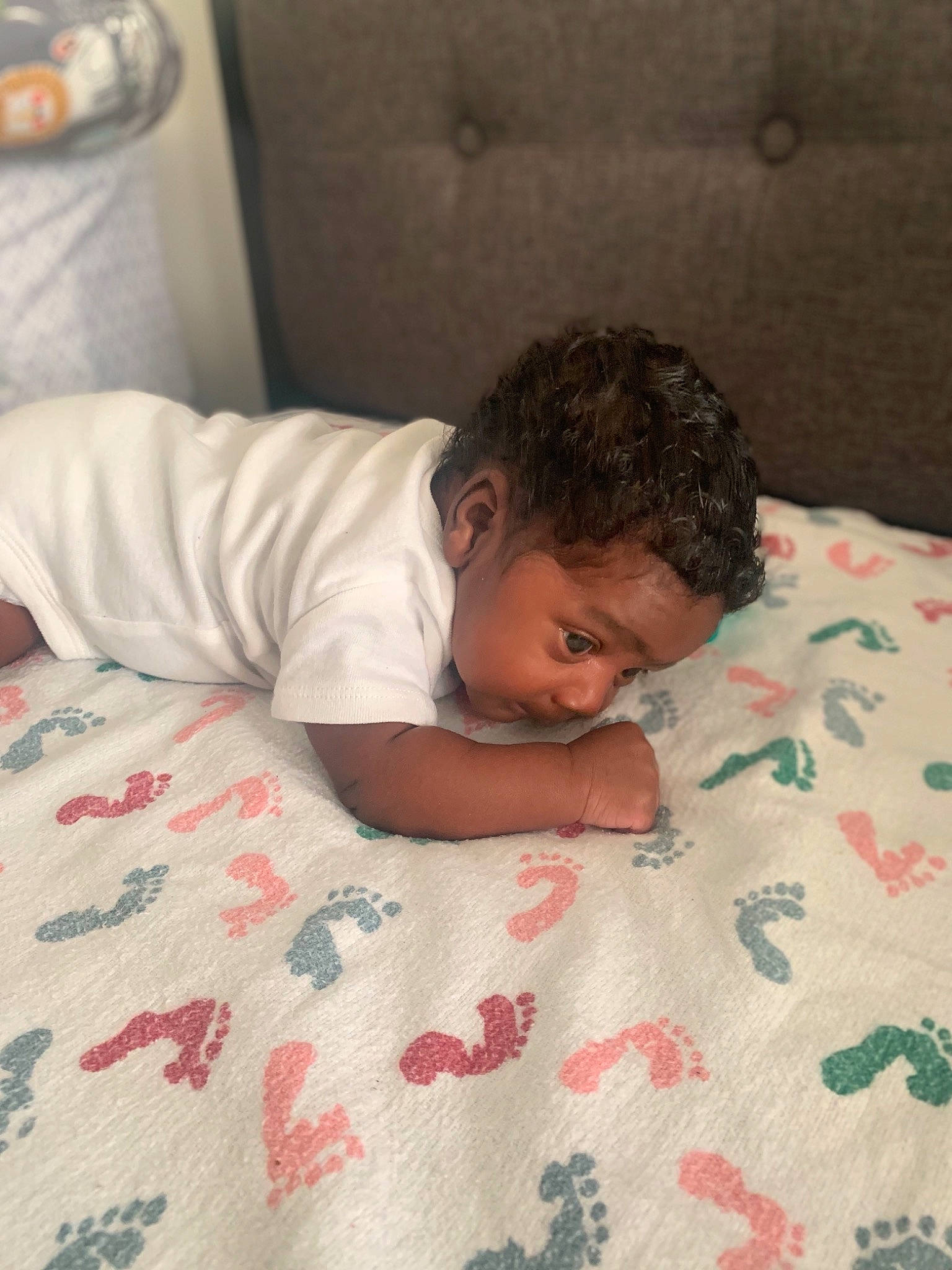 Jayvion is registered to the contest to win money with this photo: baby, bed, bed_sheet, bedding, bedroom, bedtime, child, chin, comfort, crawling, floor, flooring, hardwood, linens, mattress, pattern, person, room, textile, toddler