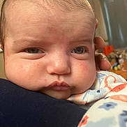 Scarlett is registered to the contest to win money with this photo: baby, closeup, face, infant, person, skin, expression, hand, blanket, pattern, indoor, child, newborn, cute, young, holding, warm, soft, portrait, human