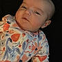 baby, infant, onesie, floral_pattern, sleepy, face, head, person, child, cute, clothing, soft, background, portrait, skin, newborn, expression, lying_down, indoor, young
