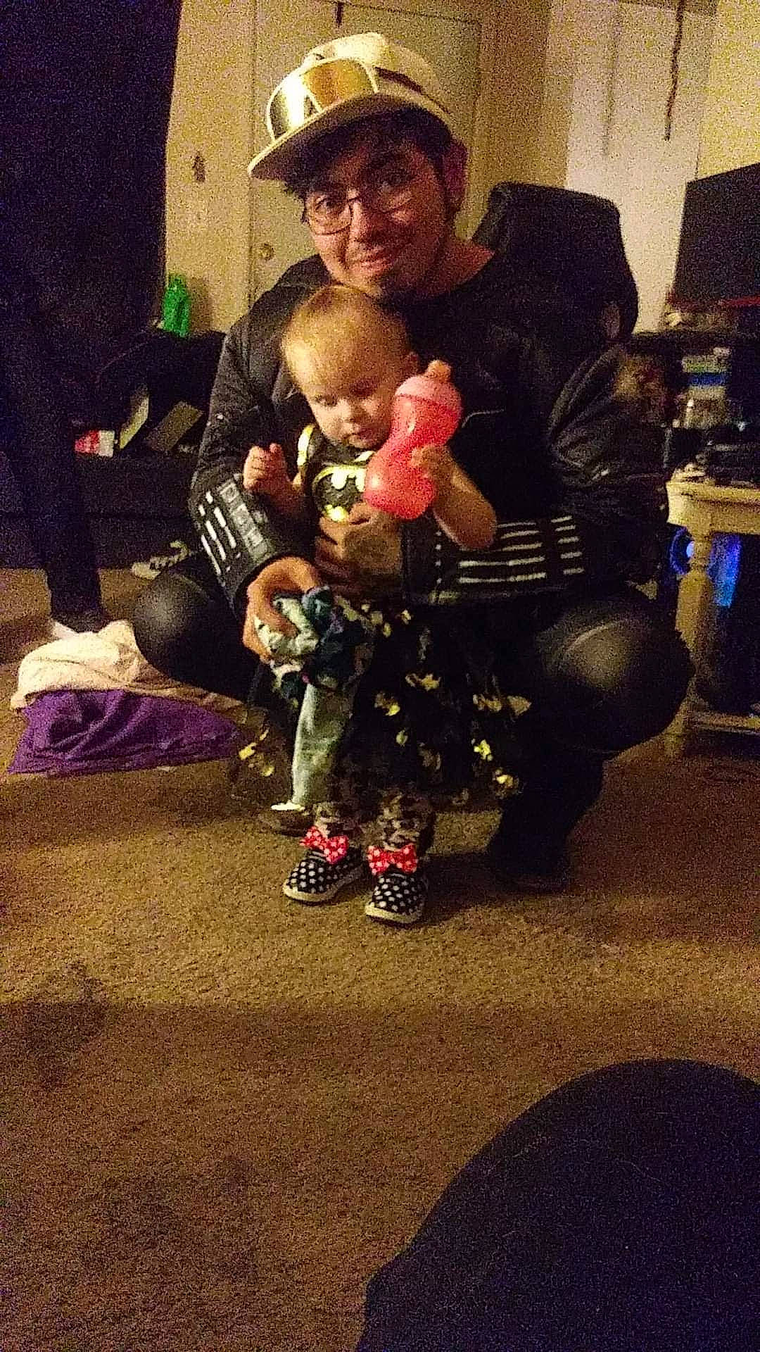 Zaylee is registered to the contest to win money with this photo: baby, boot, child, event, flooring, fun, fur, happy, hat, headwear, holiday, joy, lap, luggage_and_bags, person, room, selfie, sitting, smile, square