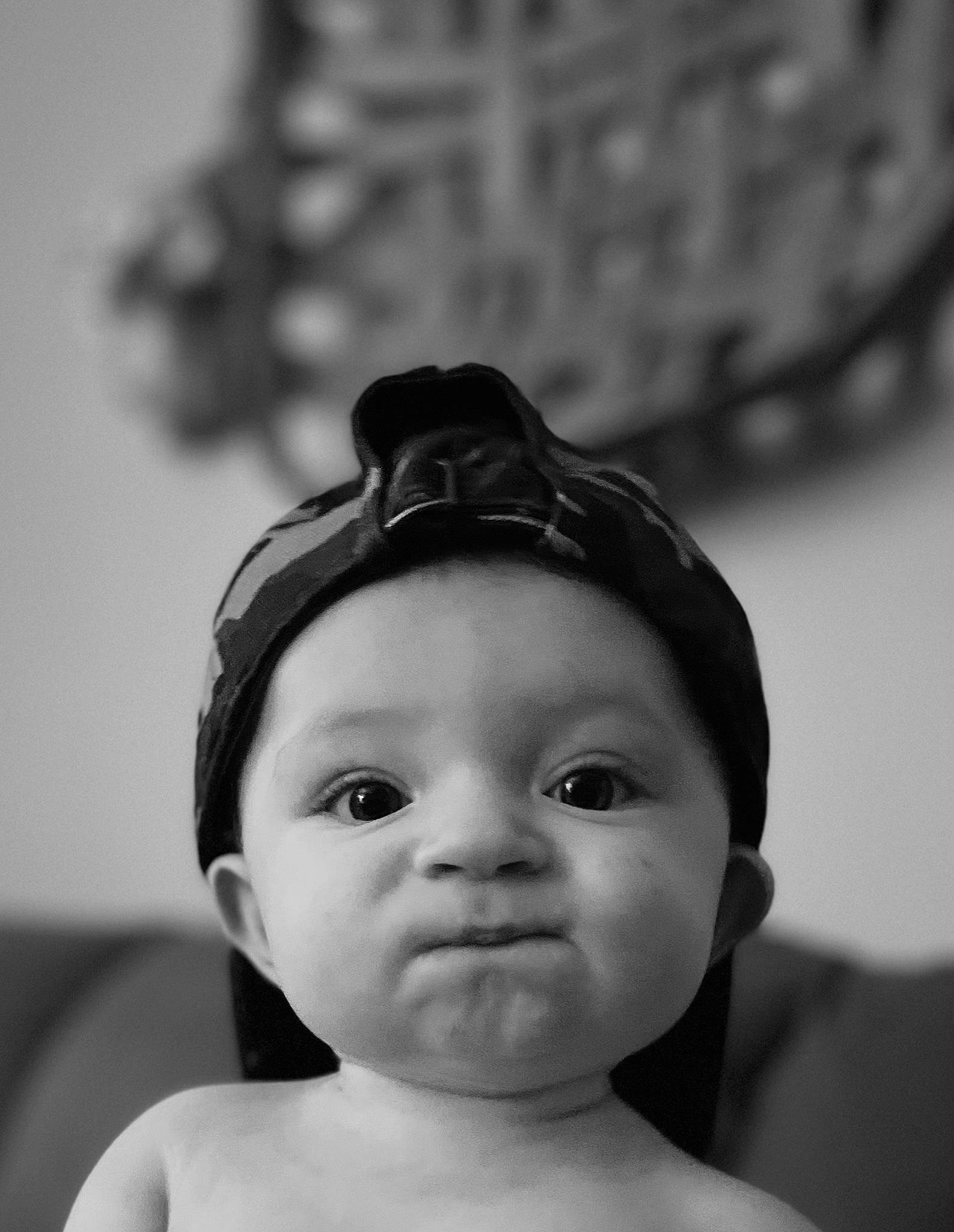 Corbin is registered to the contest to win money with this photo: baby, black_hair, cheek, chin, ear, eye, eyebrow, eyelash, face, flash_photography, forehead, hair, happy, iris, lip, monochrome, neck, person, skin, toddler