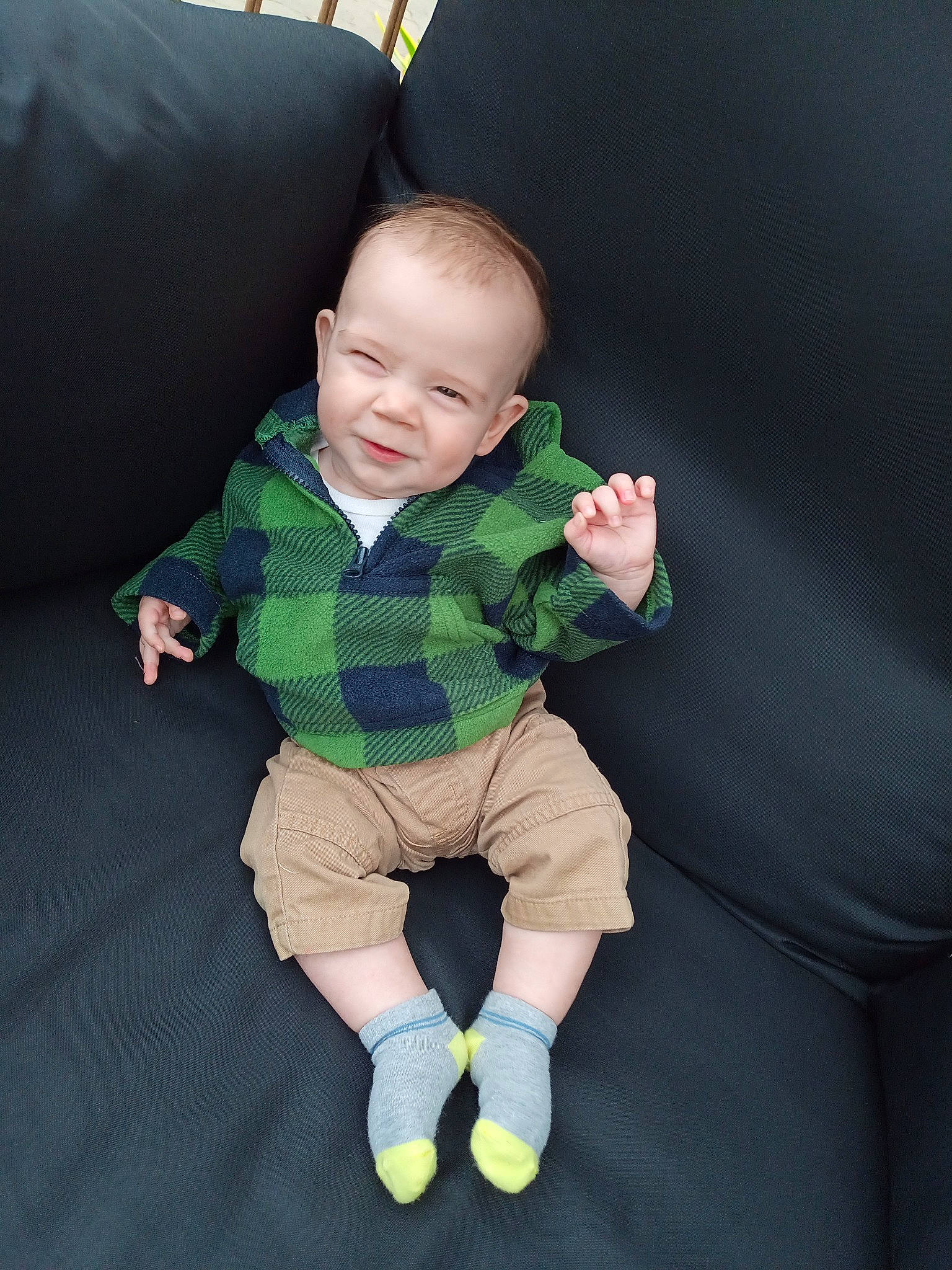 Coty is registered to the contest to win money with this photo: baby, baby_toddler_clothing, cheek, child, comfort, finger, flooring, fun, gesture, grass, human_body, linens, pattern, person, product, sitting, skin, sleeve, sock, thumb