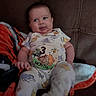 Alexander is registered to the contest to win money with this photo: baby, infant, child, couch, blanket, winnie_the_pooh, onesie, sticker, 3_month, tongue_out, cute, playful, indoor, seated, person, soft_lighting, fabric, smiling, face, home