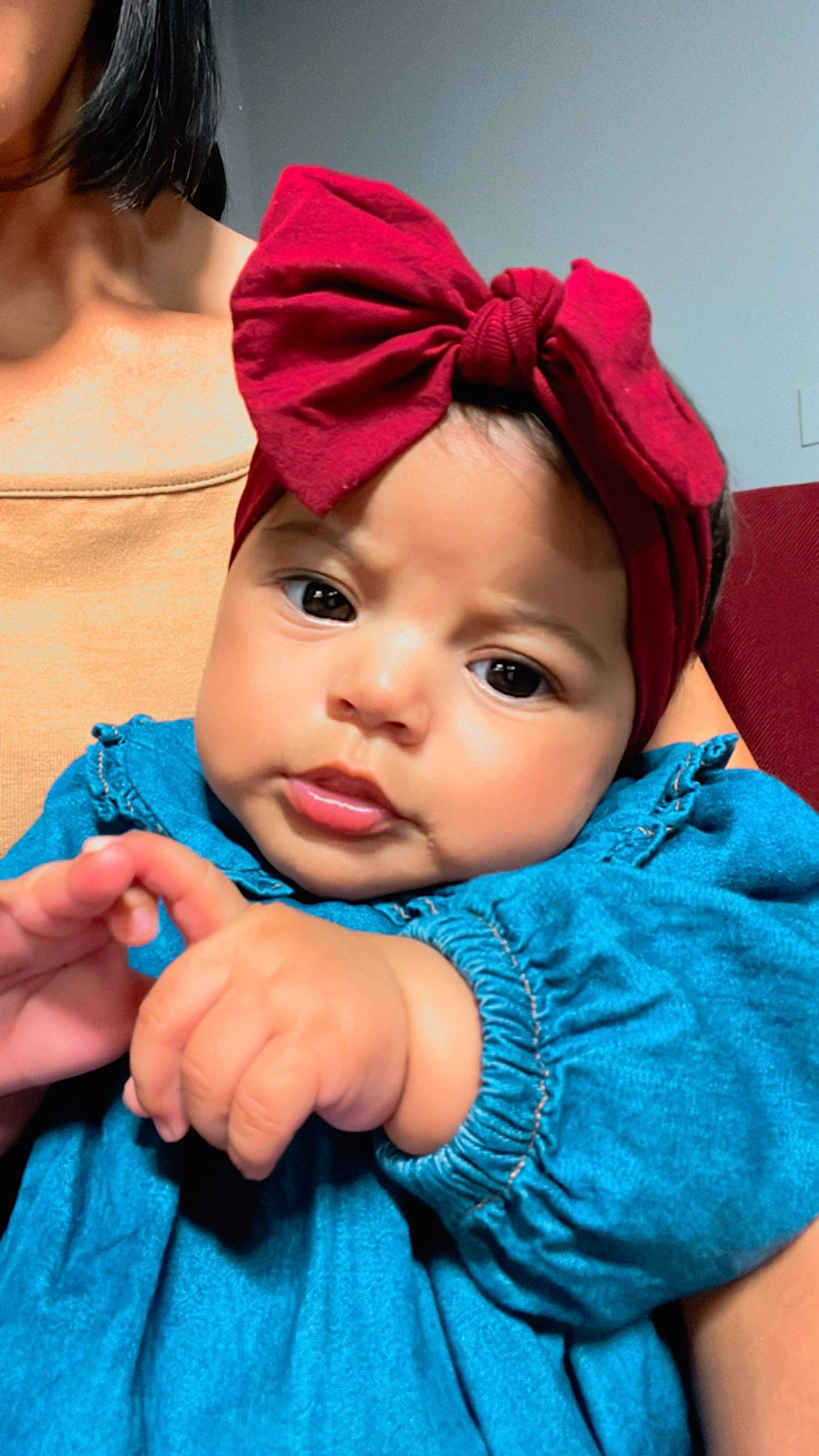 Galilea is registered to the contest to win money with this photo: baby, baby_toddler_clothing, blue, cap, chin, clothing, cool, dress, eye, face, gesture, happy, hat, headgear, headwear, iris, lip, magenta, person, pink