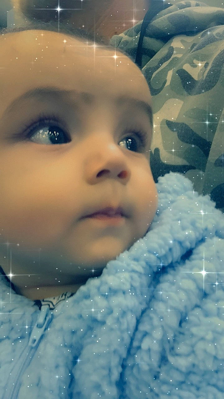 Anastacio is registered to the contest to win money with this photo: baby, cheek, child, chin, close_up, eye, eyebrow, face, facial_expression, forehead, head, iris, lip, mouth, nose, person, portrait_photography, skin, sky, smile