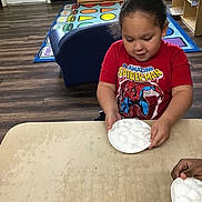 Jeriel joined the competition — help win amazing prizes! activity, books, child, classroom, cotton_balls, curly_hair, educational_rug, furniture, hand, indoor, learning, person, plate, playroom, shelf, sitting, spiderman_tshirt, table, toddler, wood_floor