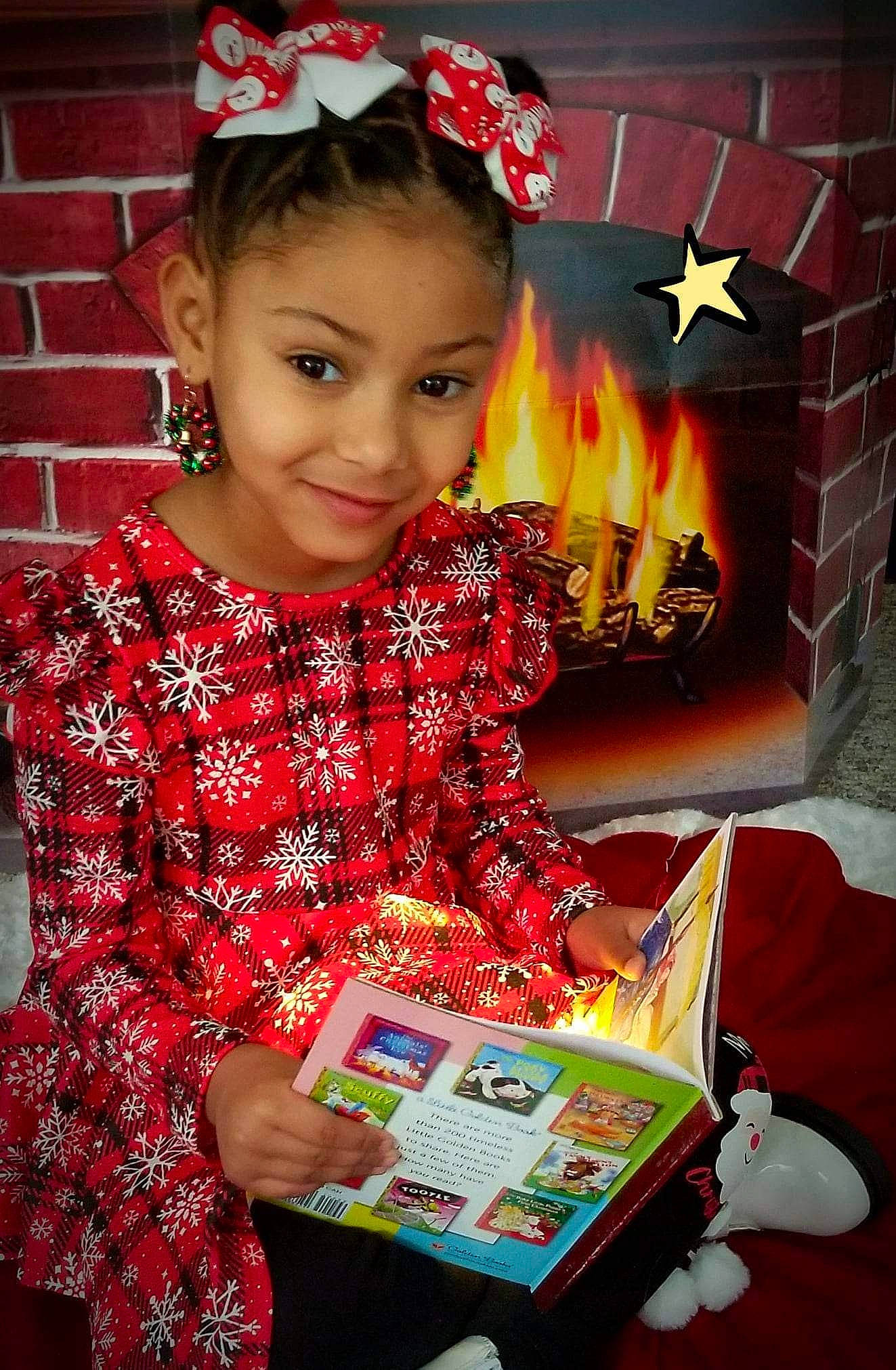 Kamari is registered to the contest to win money with this photo: child, christmas, christmas_decoration, christmas_eve, event, fashion_accessory, fun, gadget, happy, holiday, joy, lap, organ, pattern, person, present, red, sitting, sleeve, smile