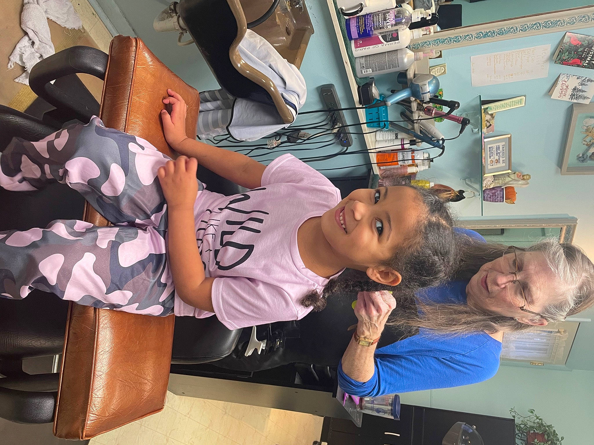 Kamari is registered to the contest to win money with this photo: bag, child, eyewear, fashion_accessory, fashion_design, fun, human_leg, joy, luggage_and_bags, person, room, service, shorts, shoulder, sportswear, t_shirt, thigh