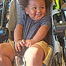 baby, baby_bottle, child, clothing, cute, expression, face, foot, hair, hand, happy, indoors, person, seatbelt, shirt, shorts, sitting, smiling, stroller, toddler