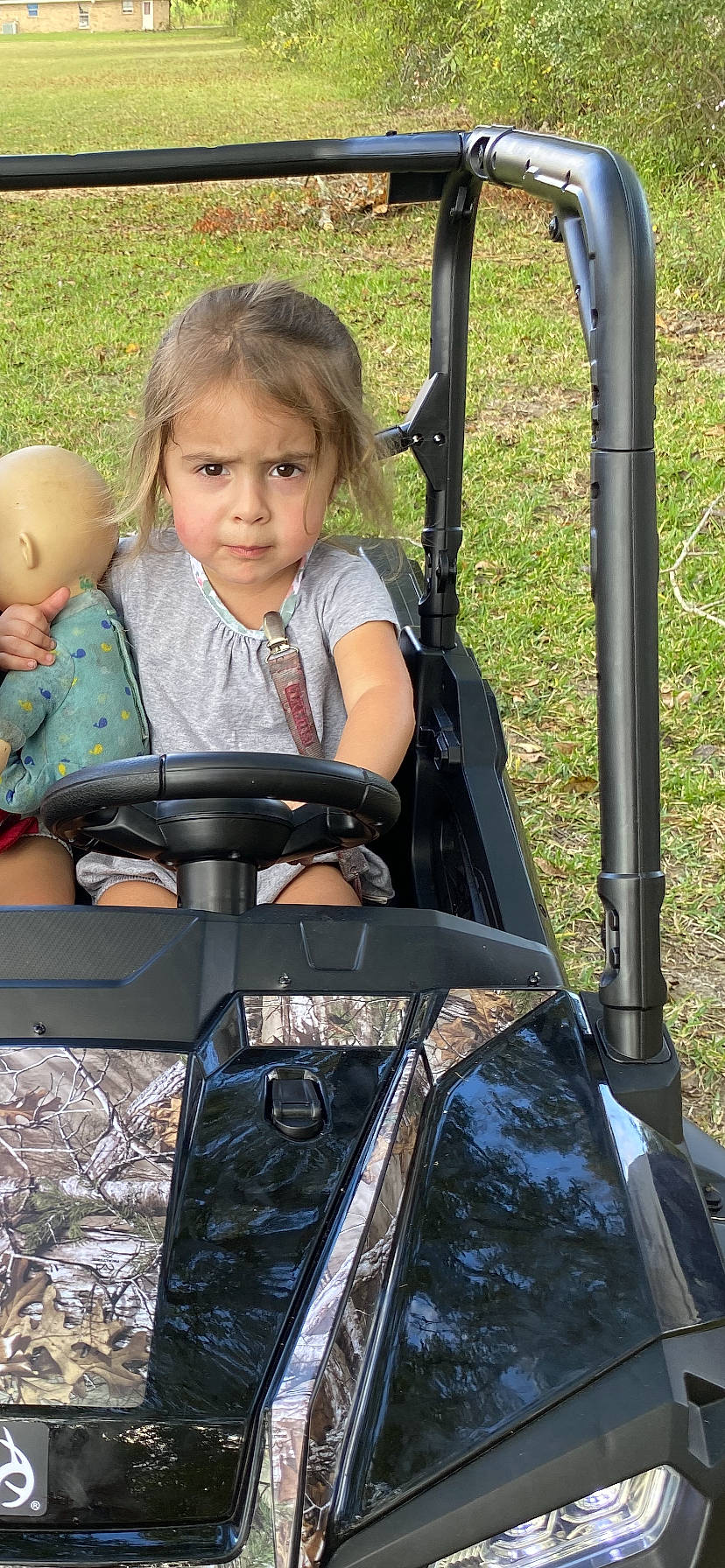 Rosalie is registered to the contest to win money with this photo: auto_part, automotive_window_part, baby, baby_carriage, baby_products, child, fun, grass, lap, leisure, motor_vehicle, people_in_nature, person, recreation, sitting, toddler, travel, vacation, windshield