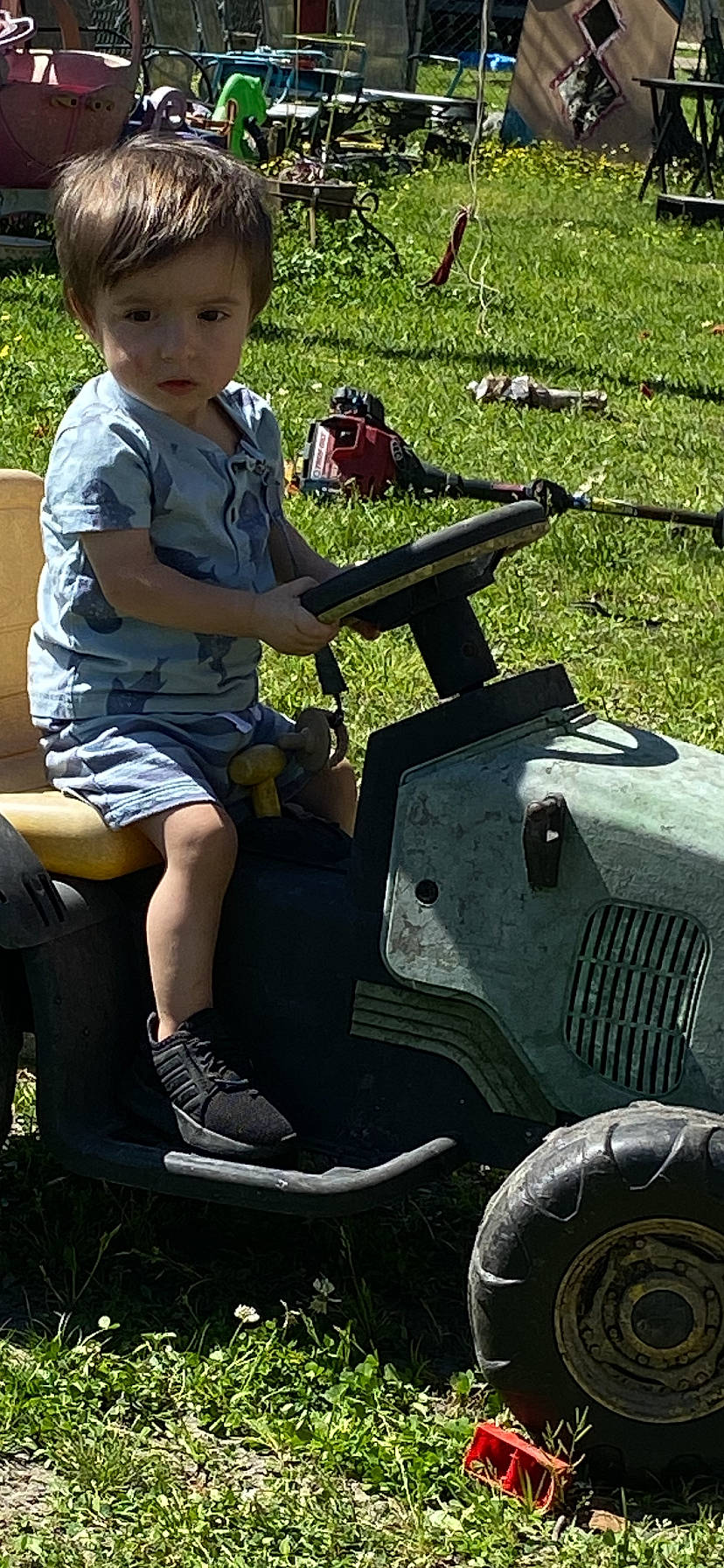 Brylon joined the competition — help win amazing prizes! automotive_tire, bumper, fender, fun, grass, green, human_leg, lap, lawn, leisure, machine, military_vehicle, motor_vehicle, person, plant, recreation, sandal, shorts, sitting, t_shirt